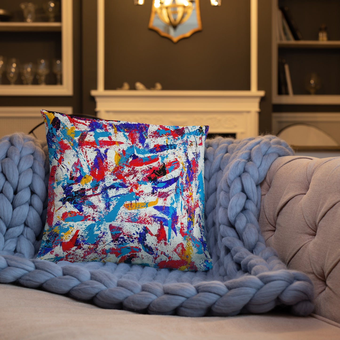 Throw pillow featuring a colorful abstract design, displayed on a neutral sofa for a bold modern accent