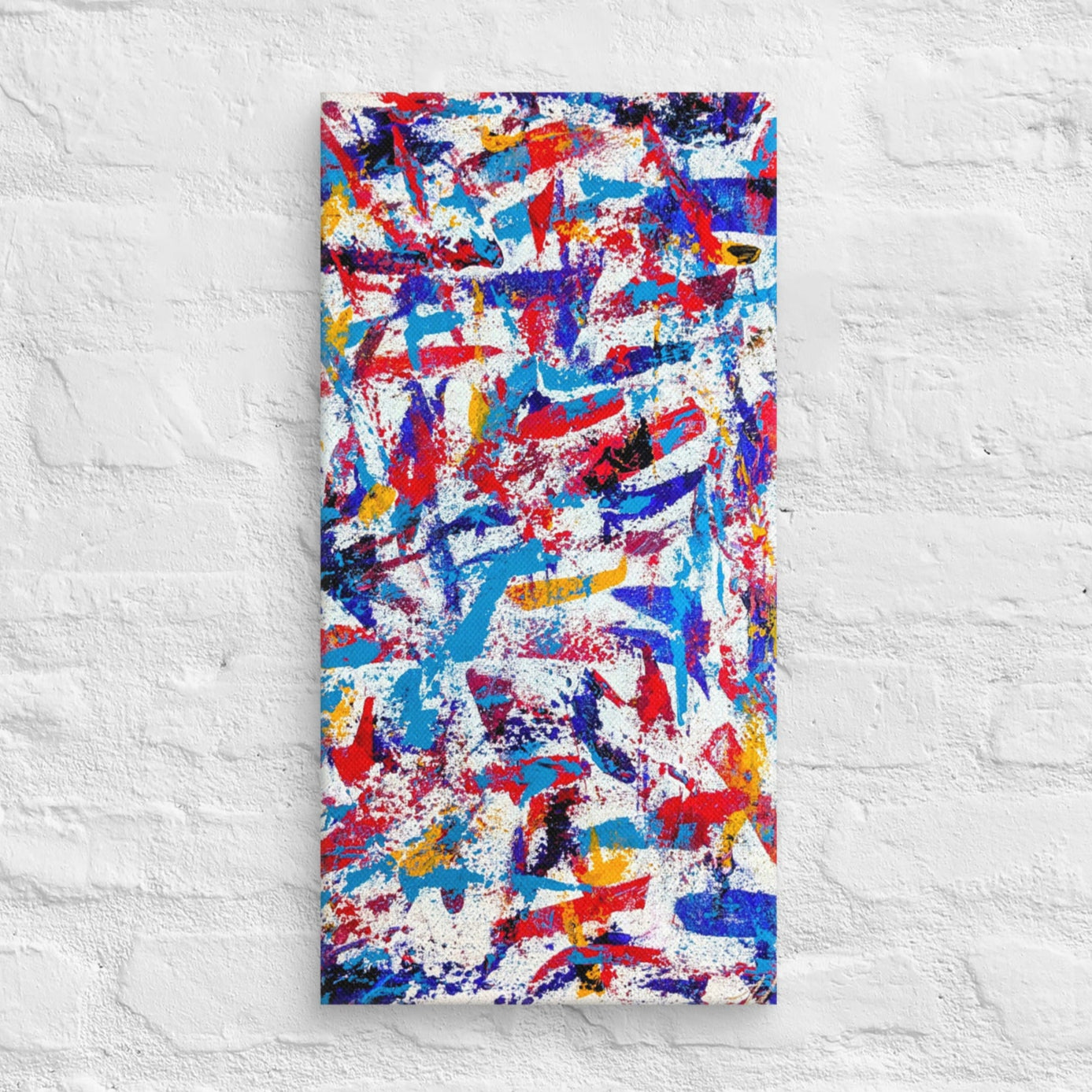 colorful canvas art print mounted on a white brick textured wall, adding vibrant energy to a minimalist interior space