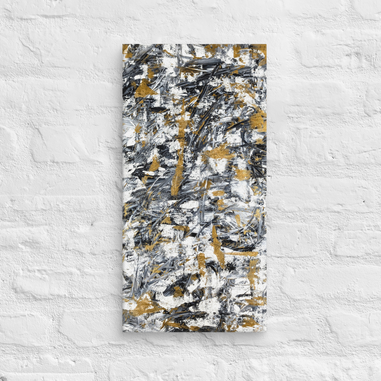 Abstract painting with black, gold, and white on a textured white wall
