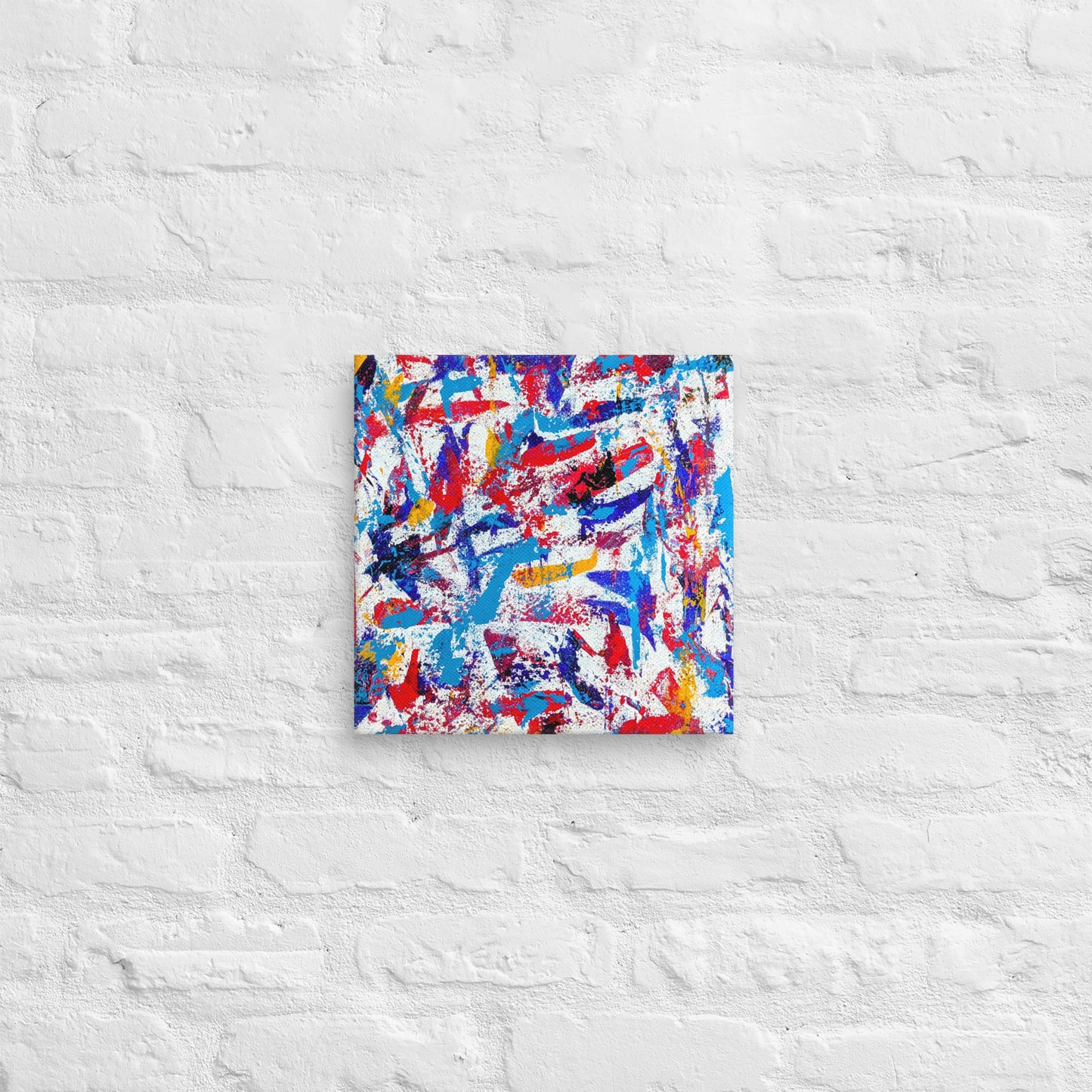 colorful canvas art print mounted on a white brick textured wall, adding vibrant energy to a minimalist interior space