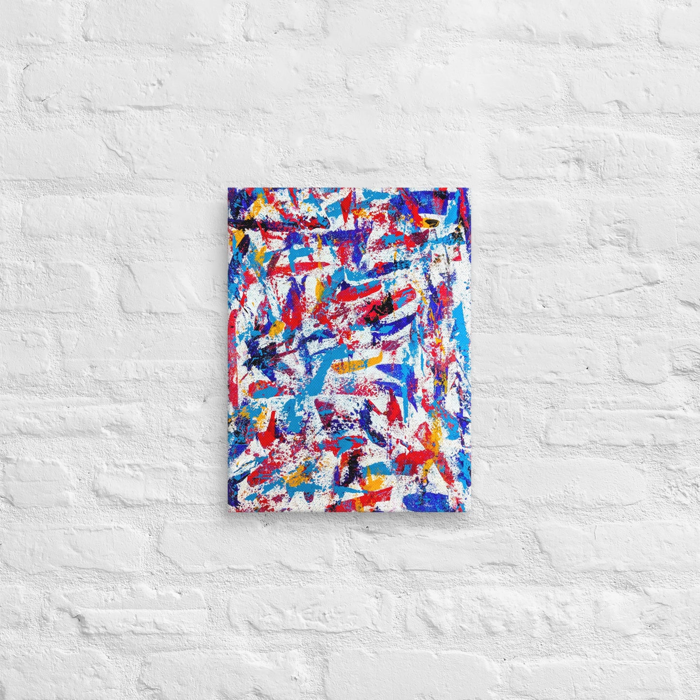 colorful canvas art print mounted on a white brick textured wall, adding vibrant energy to a minimalist interior space
