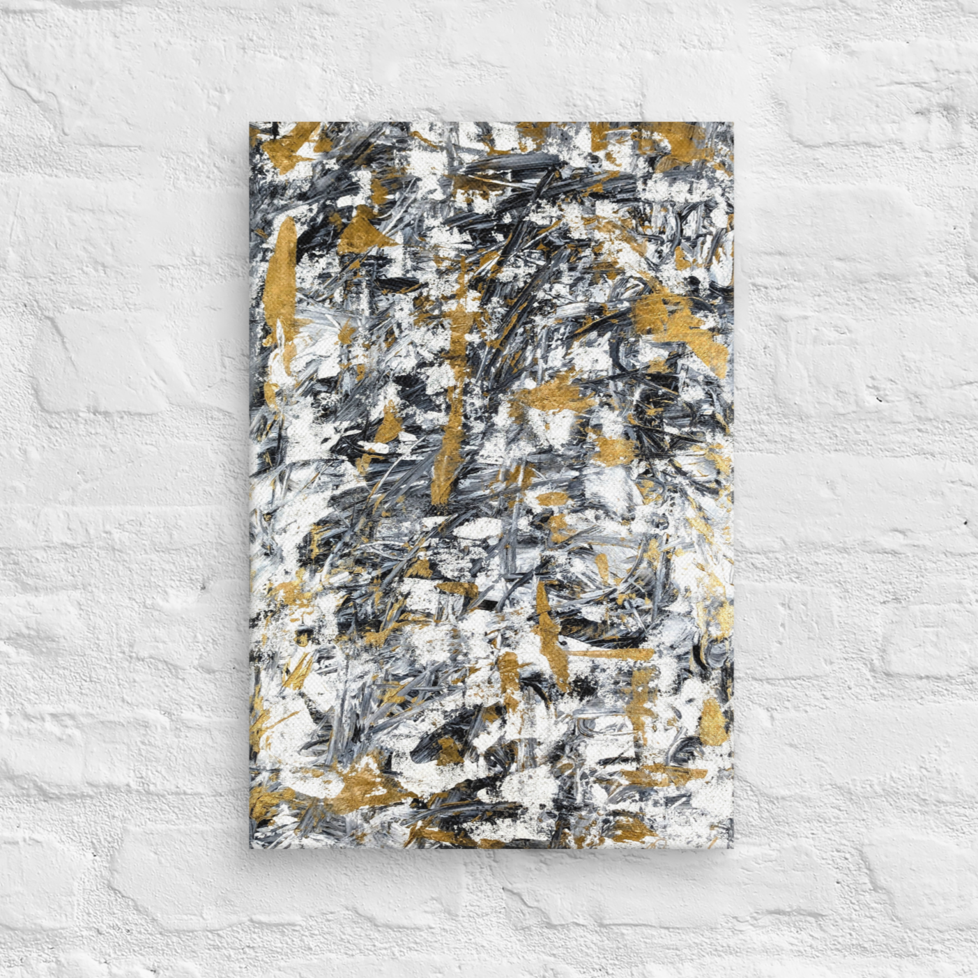 Abstract painting with black, gold, and white on a textured white wall