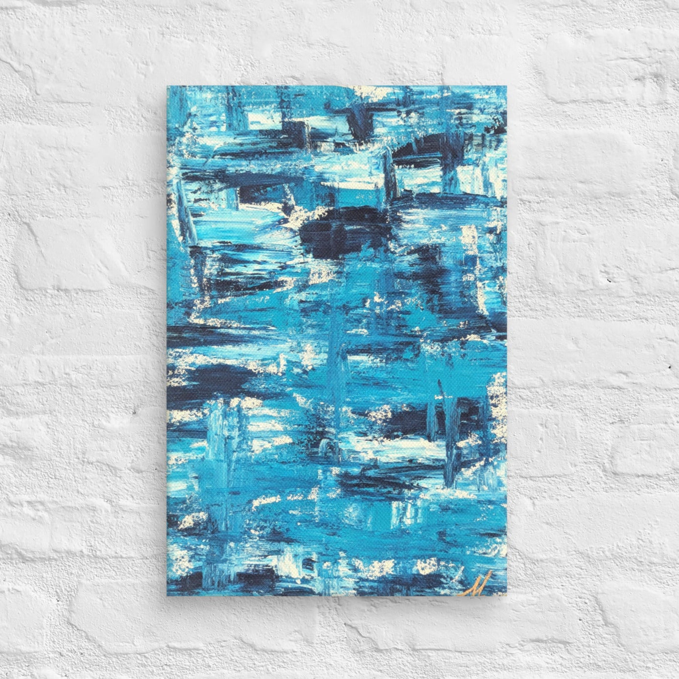 Canvas print of the abstract painting "Blue Streak" with layered blue and white brushstrokes, displayed on a white brick wall in a minimalist interior setting.