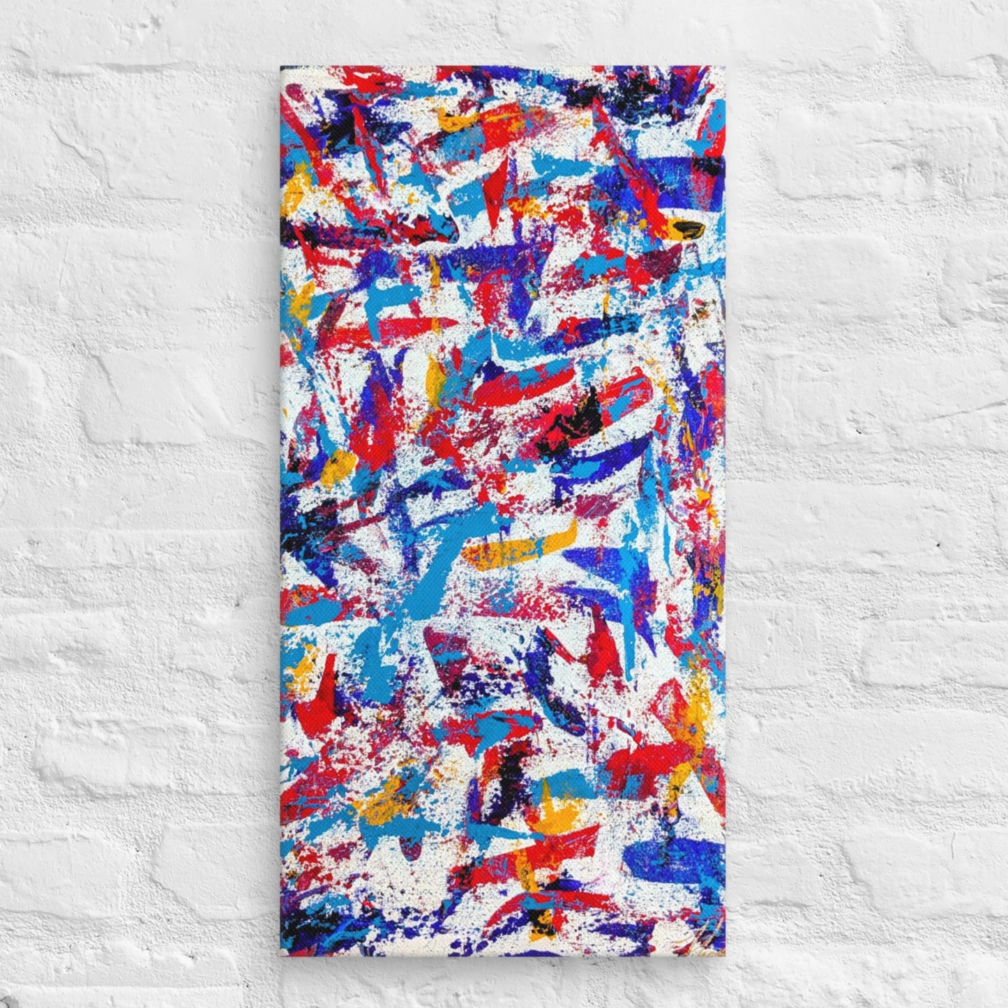 colorful canvas art print mounted on a white brick textured wall, adding vibrant energy to a minimalist interior space