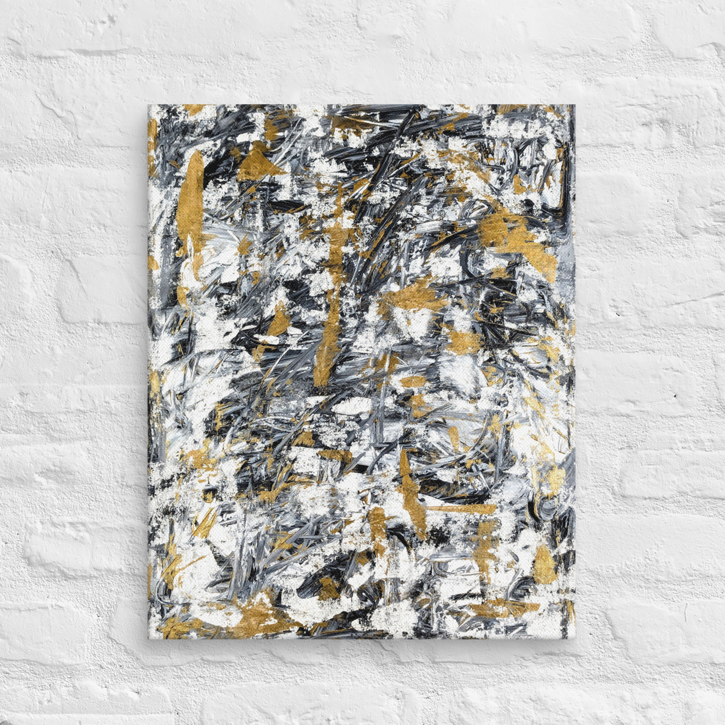 Abstract painting with black, gold, and white on a textured white wall