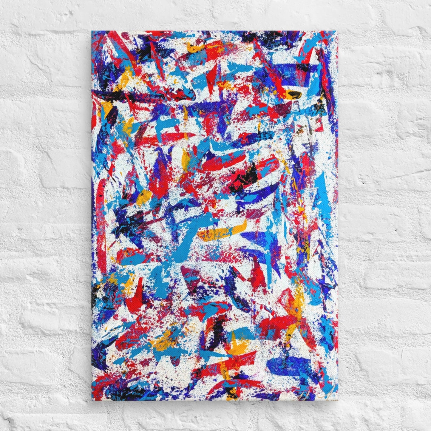 colorful canvas art print mounted on a white brick textured wall, adding vibrant energy to a minimalist interior space