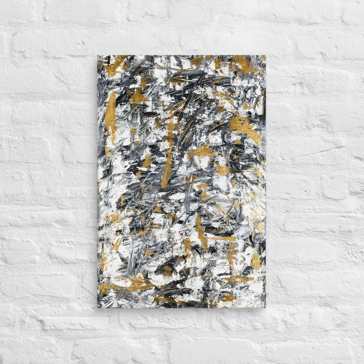 Abstract painting with black, gold, and white on a textured white wall