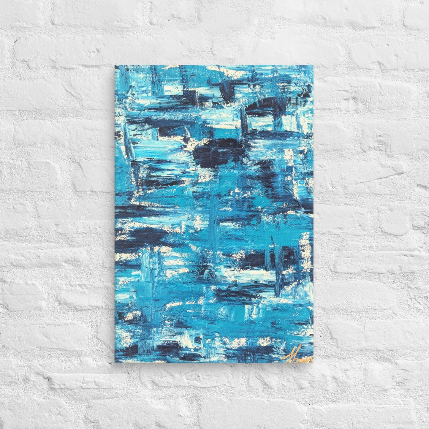 Canvas print of the abstract painting "Blue Streak" with layered blue and white brushstrokes, displayed on a white brick wall in a minimalist interior setting.