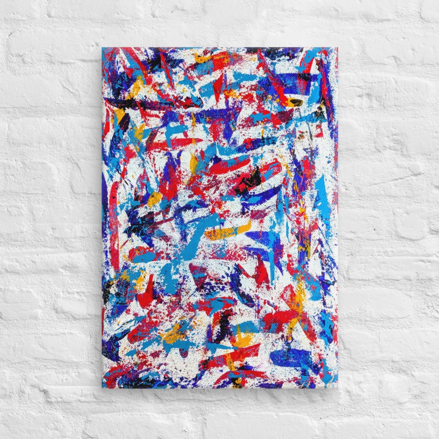 colorful canvas art print mounted on a white brick textured wall, adding vibrant energy to a minimalist interior space