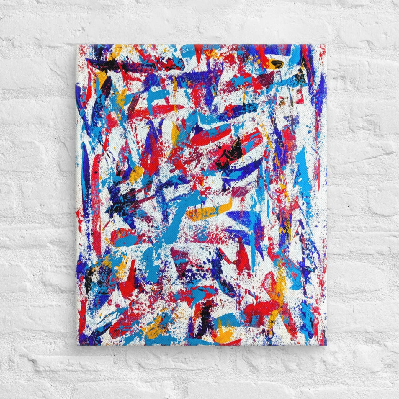 colorful canvas art print mounted on a white brick textured wall, adding vibrant energy to a minimalist interior space