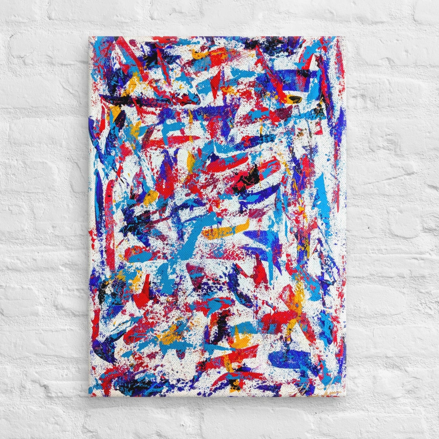 colorful canvas art print mounted on a white brick textured wall, adding vibrant energy to a minimalist interior space