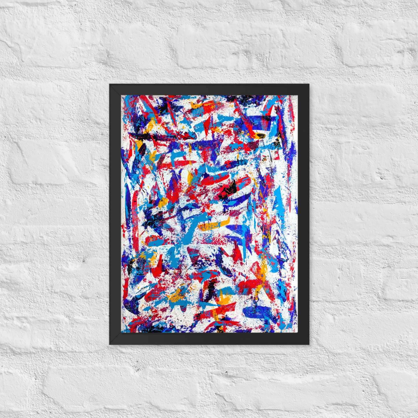 Framed abstract painting with colorful brush strokes on a white textured wall