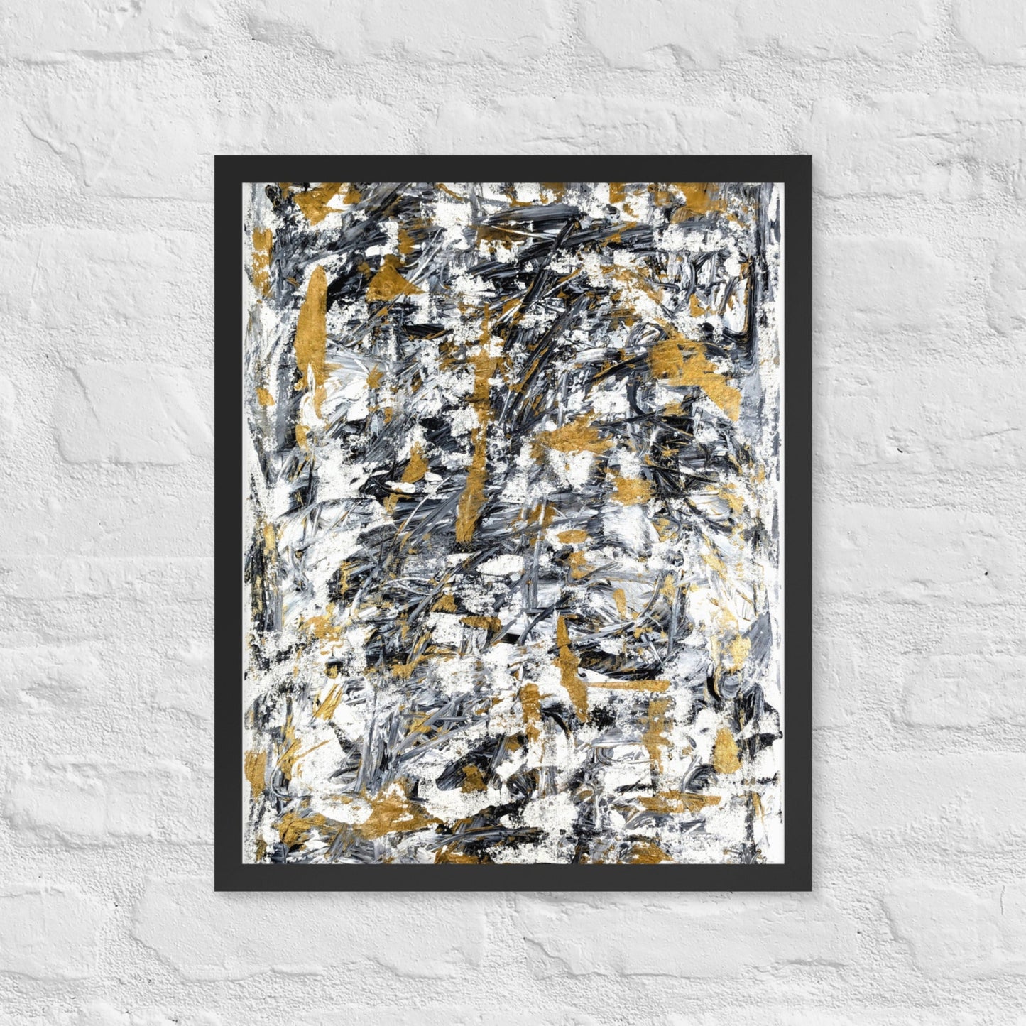 Abstract painting with black, gold, and white on a textured white wall