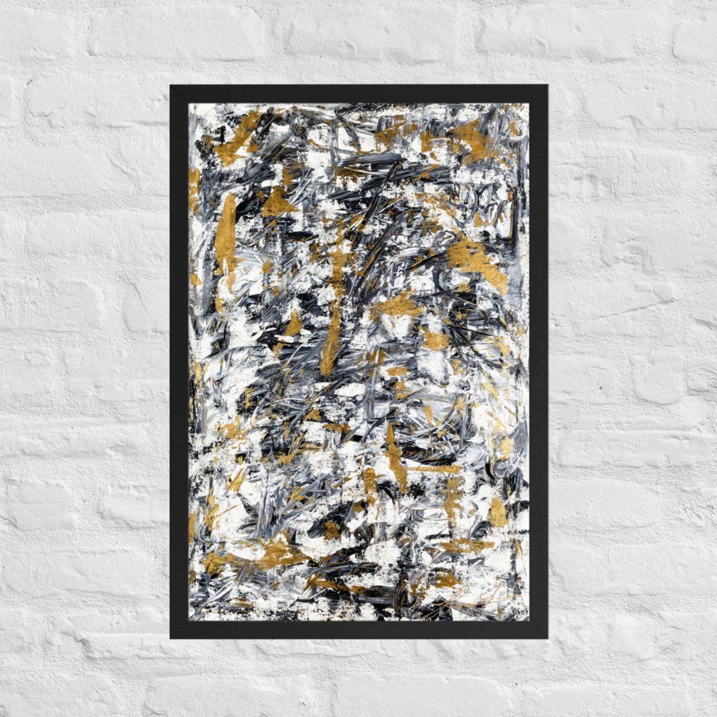 Abstract painting with black, gold, and white on a textured white wall